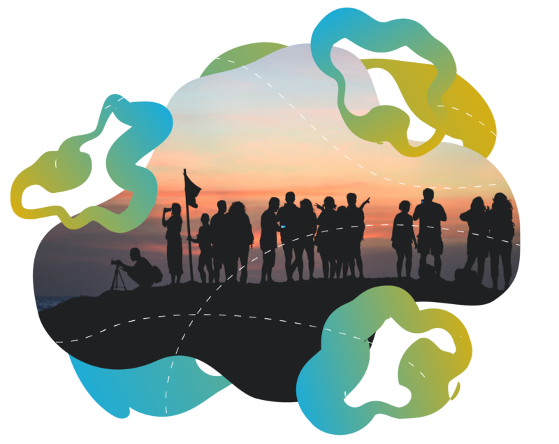 A dozen of shadows of people standing on a hill with a flag at sunset