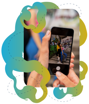 An image of someone using a phone to take a picture of two girls standing on stairs